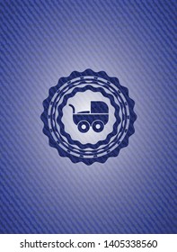 baby cart icon inside badge with jean texture