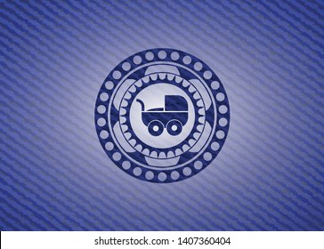 baby cart icon inside badge with denim background