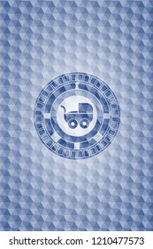 baby cart icon inside blue emblem or badge with geometric pattern background.