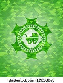 baby cart icon inside green emblem. Mosaic background