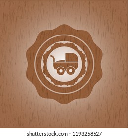baby cart icon inside realistic wooden emblem