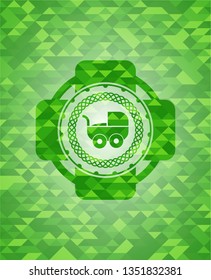 baby cart icon inside realistic green emblem. Mosaic background
