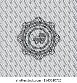 baby cart icon inside silver shiny badge. Scales pattern. Vector Illustration. Detailed.