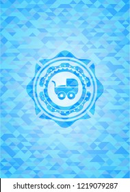 baby cart icon inside sky blue emblem with triangle mosaic background