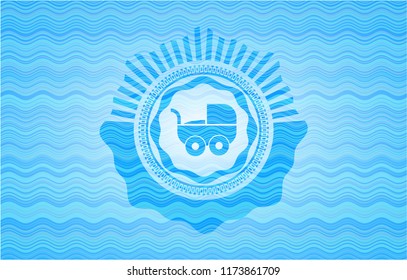 baby cart icon inside water wave badge background.