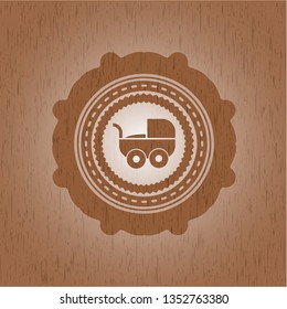 baby cart icon inside wood emblem