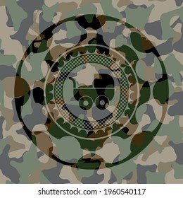 baby cart icon on camouflage pattern. 