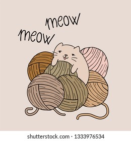 baby cat playing with balls of wool