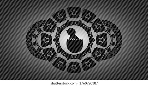 baby chick coming out of the egg icon inside carbon fiber realistic badge. Polymer texture exquisite background. Vector illustration. 