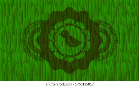 baby chicken icon inside grass sod emblem. Eco chic background. Illustration. 