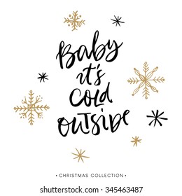 Baby it's cold outside. Christmas greeting card with calligraphy. Handwritten modern brush lettering. Hand drawn design elements.