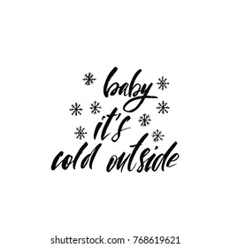 Baby it's cold outside. Holiday calligraphy phrase with hand drawn snowflakes. Christmas typography greeting card. Sketch handwritten vector illustration EPS 10 isolated on white background.