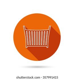 Baby crib bed icon. Child cradle sign. Newborn sleeping cot symbol. Round orange web button with shadow.
