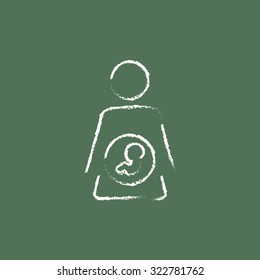 Baby fetus in womb hand drawn in chalk on a blackboard vector white icon isolated on a green background.