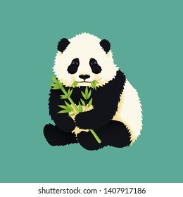 Baby giant panda holding and chewing green bamboo branches and leaves. Black and white chinese bear cub. Rare, vulnerable species.