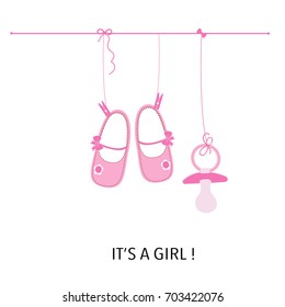 Baby girl. It's a girl. Baby shower greeting card with baby shoes and soother.