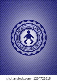 baby icon inside badge with denim background