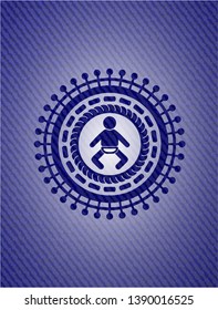 baby icon inside badge with denim texture