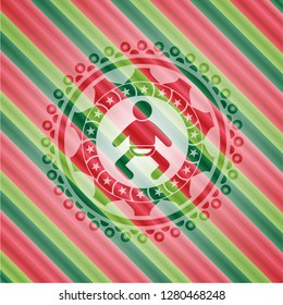 baby icon inside christmas colors style badge.