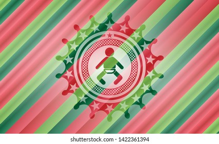 baby icon inside christmas colors emblem.
