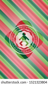 baby icon inside christmas colors style badge.