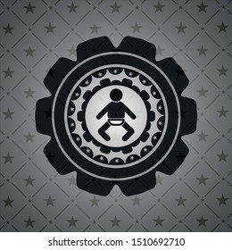 baby icon inside dark emblem