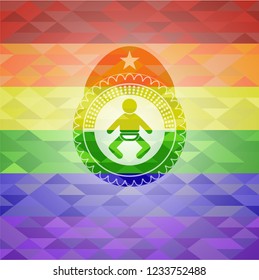 baby icon inside emblem on mosaic background with the colors of the LGBT flag