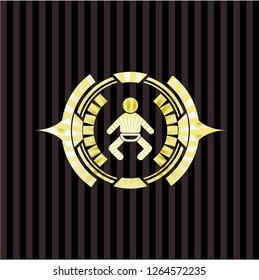 baby icon inside golden emblem