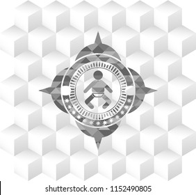 baby icon inside grey badge with geometric cube white background