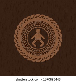 baby icon inside realistic wood emblem
