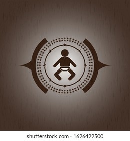 baby icon inside retro style wooden emblem