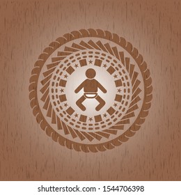 baby icon inside retro wooden emblem