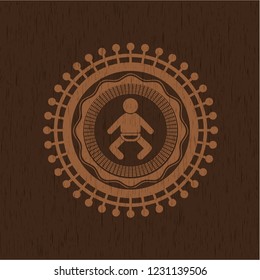 baby icon inside wooden emblem. Vintage.