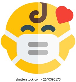 baby with a love heart wearing the mask
