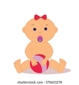 Baby with a pacifier and a ball