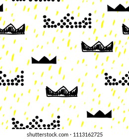 Baby seamless pattern with crowns and dots painted with a brush. Cute baby and little princess design. Children's room wallpaper and clothes texture. Scandinavian style. Black and white.