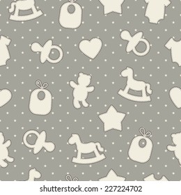 Baby seamless pattern. Gray, cream colors. Illustrations of rocking horse, pacifier, baby clothes, teddy bear, bib, star, heart on star-shaped background. 