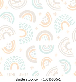 Baby seamless pattern with hand drawn rainbows. Trendy childish background.