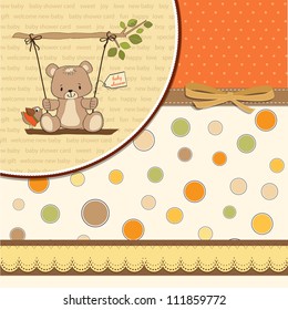 baby shower card with teddy bear in a swing