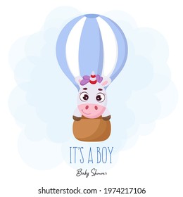Baby Shower greeting card with cute magic unicorn flying on hot air balloon. Funny magic unicorn cartoon character with phrase "It's a boy". Bright colored childish stock vector illustration.