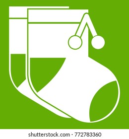Baby socks icon white isolated on green background. Vector illustration