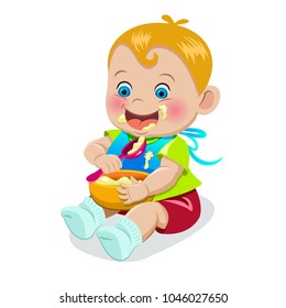 The baby with a spoon in hand eats