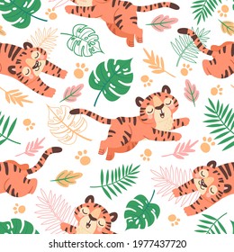 Baby tiger seamless pattern. Cute childish cartoon tigers, paw and tropical leaves. Jungle animal, wild cats, kids vector wallpaper. Pattern wallpaper with tiger, baby childish background illustration