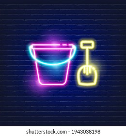 Baby toy bucket and shovel neon icon. Glowing Vector illustration of child signs for design. Children toy concept.