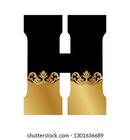 back and gold baroque letter h