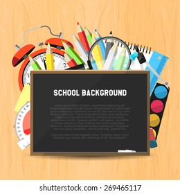 Back to school background - blackboard and supplies on wooden background. Flat design style