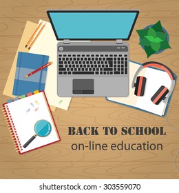 Back to school background. Concept of banner for online education with flat designed objects isolated on wooden table.