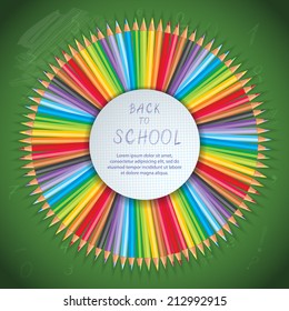 Back to school background with pencils on board with space for text