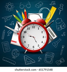 Back to school background with red alarm clock and school supplies