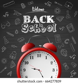 Back to school background with red alarm clock